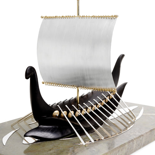 Image of a viking ship sculpture made from yellow gold, green Connemara marble, Irish bog oak and sterling silver sail