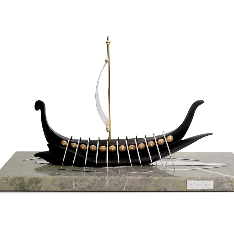 Image of a viking ship sailing boat sculpture made from yellow gold, green Connemara marble, Irish bog oak and sterling silver sail side profile 