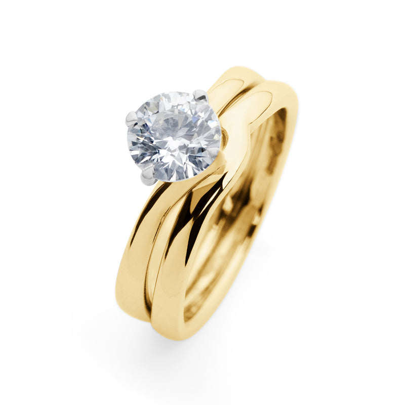 Solitaire Round Brilliant Cut Diamond Engagement Ring with a Twist in Yellow Gold