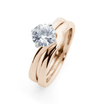 Solitaire Round Brilliant Cut Diamond Engagement Ring with a Twist in Rose Gold