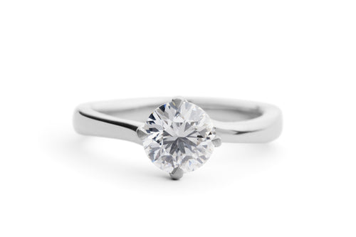 Solitaire Round Brilliant Cut Diamond Engagement Ring with a Twist in Platinum